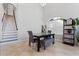 Bright dining area with a table and bench seating near a large window and staircase at 820 Spring Oak Cir, Orlando, FL 32828