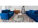 Loft features two blue couches and a geometric rug at 820 Spring Oak Cir, Orlando, FL 32828