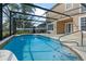 Inviting screened pool with lake views and ample deck space at 820 Spring Oak Cir, Orlando, FL 32828