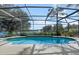 Relaxing screened pool overlooking a tranquil lake at 820 Spring Oak Cir, Orlando, FL 32828