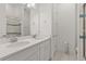 Double vanity bathroom with a walk-in shower at 8361 Ludington Cir, Orlando, FL 32836