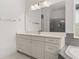 Elegant bathroom featuring a vanity with ample storage and a large mirror at 8361 Ludington Cir, Orlando, FL 32836