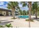 Relaxing community pool area with palm trees and patio at 8361 Ludington Cir, Orlando, FL 32836