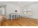 Hardwood floors and dog kennels in a bright dining area at 8361 Ludington Cir, Orlando, FL 32836