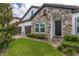 Front entrance with stone accents and a double door at 8361 Ludington Cir, Orlando, FL 32836