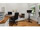 Bright home office featuring a corner desk and exercise equipment at 8361 Ludington Cir, Orlando, FL 32836