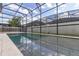 Screened pool and patio with plenty of space for relaxation at 8361 Ludington Cir, Orlando, FL 32836