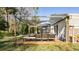 Outdoor seating area with wooden deck and sun shade at 862 Shriver Cir, Lake Mary, FL 32746