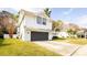 A bright white house with a grey two-car garage, set on a green lawn at 862 Shriver Cir, Lake Mary, FL 32746