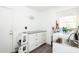 Laundry room with stainless steel sink and white washer and dryer at 862 Shriver Cir, Lake Mary, FL 32746