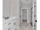 Bathroom featuring a granite vanity, updated flooring, and updated paint colors at 9095 Sw 125Th Ter, Dunnellon, FL 34432