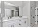 Bathroom with double vanity, granite countertops, updated colors, and updated flooring at 9095 Sw 125Th Ter, Dunnellon, FL 34432