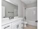 Bathroom featuring a modern vanity, shower over tub, and white subway tile at 9095 Sw 125Th Ter, Dunnellon, FL 34432