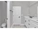 Bathroom features a granite vanity, toilet, and updated neutral colors at 9095 Sw 125Th Ter, Dunnellon, FL 34432