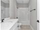 Clean bathroom with white vanity, tub-shower, and subway tile surround at 9095 Sw 125Th Ter, Dunnellon, FL 34432
