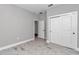 Bedroom with wood-look tile floors and a closet with sliding doors at 9095 Sw 125Th Ter, Dunnellon, FL 34432