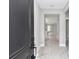 Welcoming entryway with wood-look tile floors and contemporary gray wall paint at 9095 Sw 125Th Ter, Dunnellon, FL 34432
