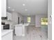 Open-concept kitchen featuring an island, stainless appliances, and ample counter space at 9095 Sw 125Th Ter, Dunnellon, FL 34432