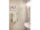 Clean bathroom with a sink, toilet, and decorative artwork at 1100 Pavia Dr, Apopka, FL 32703