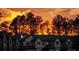 Townhouses at sunset with lush green trees at 1100 Pavia Dr, Apopka, FL 32703