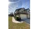 Two-story house with attached garage and landscaped front yard at 1100 Pavia Dr, Apopka, FL 32703