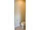 Small half bathroom with toilet and pedestal sink at 1100 Pavia Dr, Apopka, FL 32703