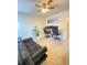 Home office with two desks and a comfortable sofa at 1100 Pavia Dr, Apopka, FL 32703