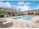 Community pool with plenty of lounge chairs at 1100 Pavia Dr, Apopka, FL 32703