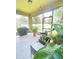 Relaxing screened porch with patio furniture and grill at 1100 Pavia Dr, Apopka, FL 32703