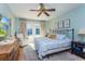 Bright main bedroom featuring a king-size bed and access to backyard at 1102 Wilkinson St, Orlando, FL 32803