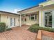 Brick patio with French doors and landscaping at 1138 Overbrook Dr, Orlando, FL 32804