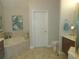 Relaxing bathroom with corner jacuzzi tub and separate shower at 1161 Charming St, Maitland, FL 32751