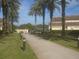 Landscaped walkway leading to community amenities at 1161 Charming St, Maitland, FL 32751