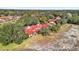 Aerial view of Spanish-style homes and lush landscaping in a community setting at 140 Stratford Ct, Haines City, FL 33844