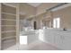 Bathroom boasts a large garden tub, double vanity, and shelving at 140 Stratford Ct, Haines City, FL 33844