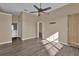 Spacious bedroom with wood-look floors and access to bathroom at 140 Stratford Ct, Haines City, FL 33844