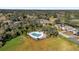 Community pool and recreation area with surrounding green space at 140 Stratford Ct, Haines City, FL 33844