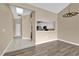 Dining room with gray vinyl flooring and view into kitchen at 140 Stratford Ct, Haines City, FL 33844