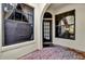 Exterior entryway with brick flooring, arched entryway, and windows at 140 Stratford Ct, Haines City, FL 33844