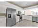 Kitchen with stainless steel appliances and white cabinets at 140 Stratford Ct, Haines City, FL 33844