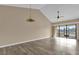 Living area with high ceilings, sliding glass doors, and ceiling fan at 140 Stratford Ct, Haines City, FL 33844