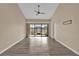 Spacious living room with sliding glass doors to the patio and high ceilings at 140 Stratford Ct, Haines City, FL 33844