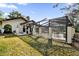 Home with a screened-in pool and patio area, perfect for outdoor entertaining at 140 Stratford Ct, Haines City, FL 33844