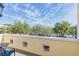Private balcony overlooking parking lot and treetops at 1407 Chatfield Pl, Orlando, FL 32814