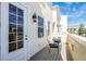 Private balcony with table and chairs, perfect for relaxing outdoors at 1407 Chatfield Pl, Orlando, FL 32814