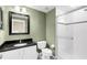 Clean bathroom with granite countertop, white cabinets and shower at 1407 Chatfield Pl, Orlando, FL 32814
