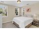 Bright bedroom with a queen-size bed and neutral decor at 1407 Chatfield Pl, Orlando, FL 32814