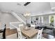 Bright dining area with hardwood floors and a view of the living room at 1407 Chatfield Pl, Orlando, FL 32814