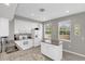 Modern kitchen with white cabinets, granite counters, and island at 1407 Chatfield Pl, Orlando, FL 32814