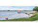 Scenic lakefront view with gazebo and walking path at 1407 Chatfield Pl, Orlando, FL 32814